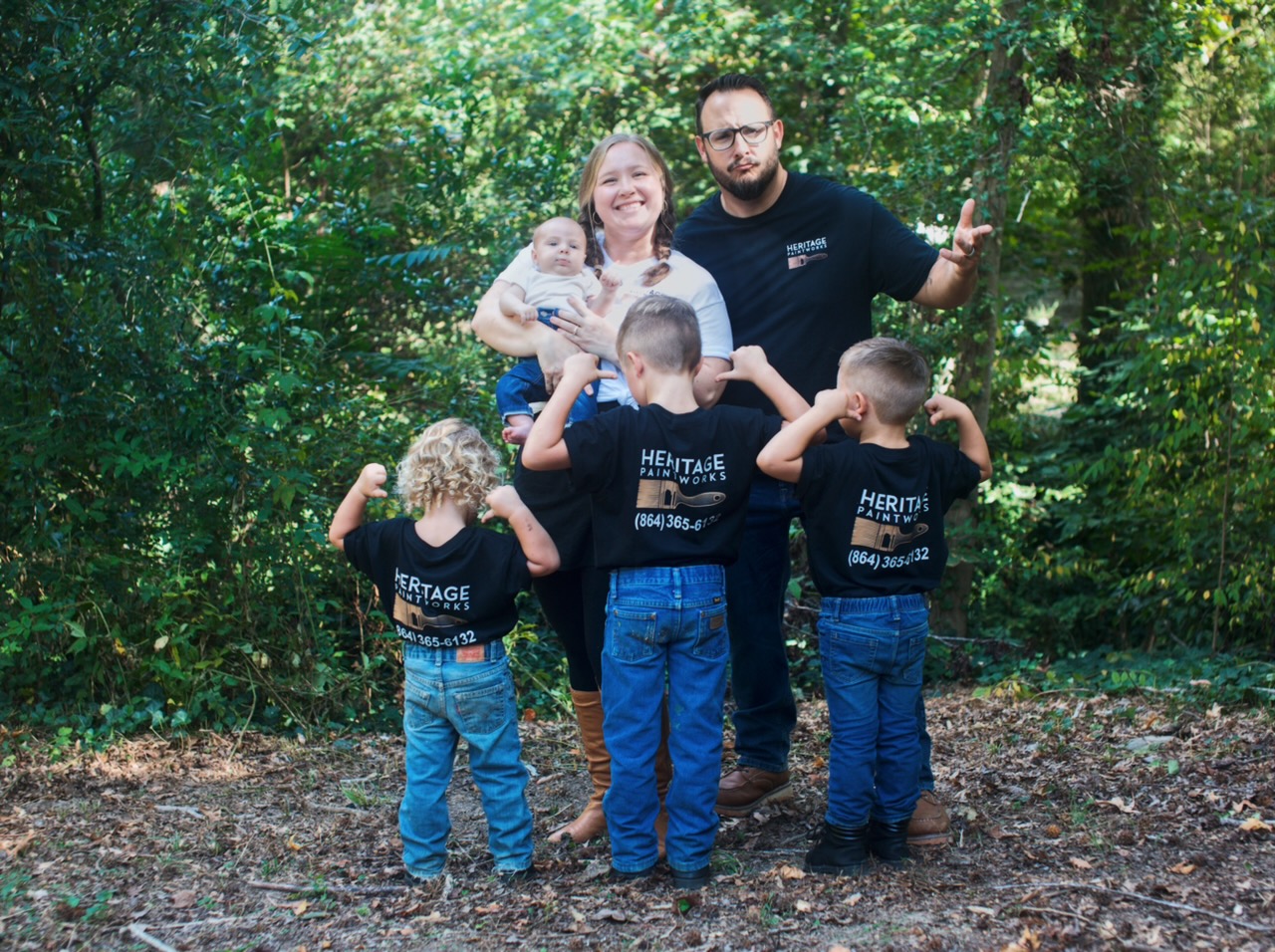 The Costa family flexing in their Heritage Paintworks shirts, phone number on the back